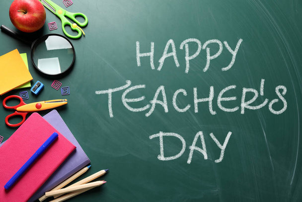 Text Happy Teacher's Day and different school stationery on green chalkboard, flat lay. Greeting card design - Zdjęcie, obraz