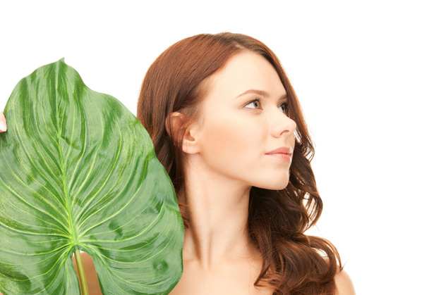 Woman with green leaf - Foto, Bild