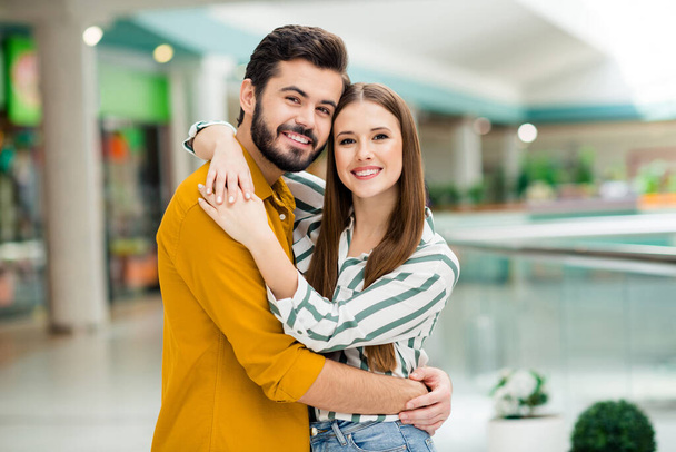 Portrait of his he her she nice attractive lovely charming tender sweet dreamy cheerful cheery couple dating meeting embracing in downtown building spending vacation - Foto, Imagen