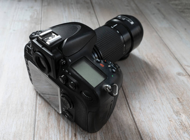 Professional DSLR camera on wooden background - Photo, Image