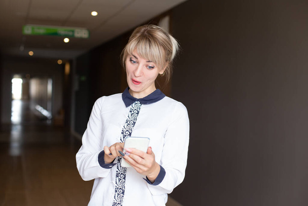 the beautiful and happy blonde with phone - Фото, зображення