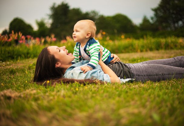 Mother with baby outdoors - 写真・画像