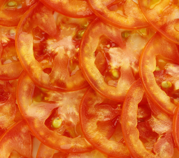 Red tomato slide ; background. - Photo, Image