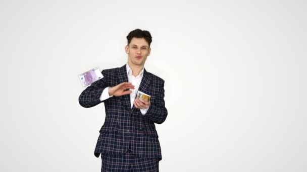 Man in formal suit throwing money in the air on gradient background. - Footage, Video