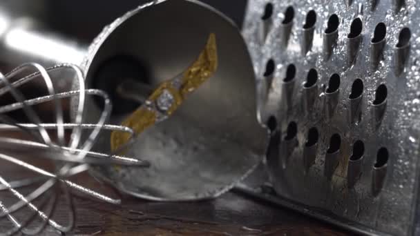 Close-up view of kitchen utensil. Kitchen grater, whisk and blender attachment. - Footage, Video