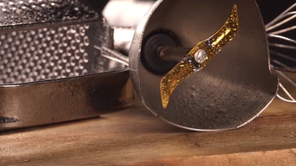 Close-up view of kitchen utensil. Kitchen grater, whisk and blender attachment. - Footage, Video