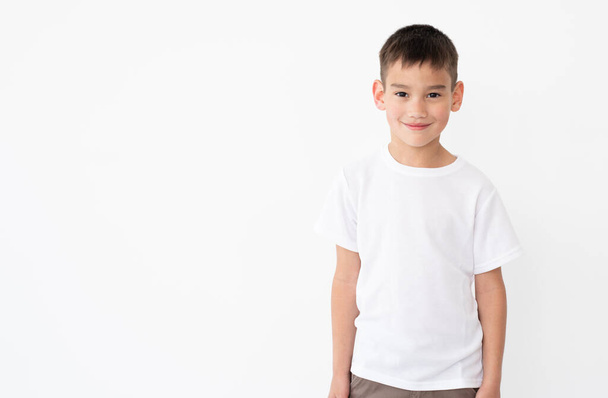Cute little boy wearing blank t-shirt - Foto, afbeelding