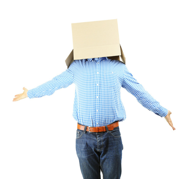 Man with cardboard box on his head isolated on white - Foto, afbeelding