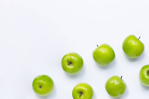 Green apples on white background. Copy space - Фото, изображение