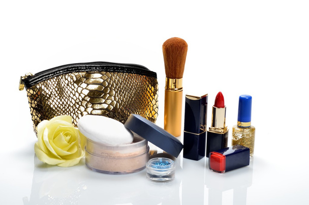 Items for decorative cosmetics, makeup, mirror and flowers - Photo, Image