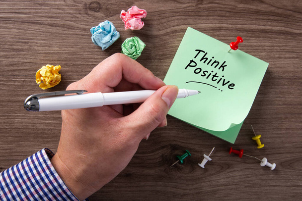 Man Hand Writing A Word Of Think Positive. Optimistic Attitude Mindset Concept - Photo, Image
