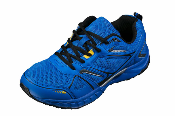 Blue sneaker with yellow accents isolated. Sports shoes. - Photo, Image