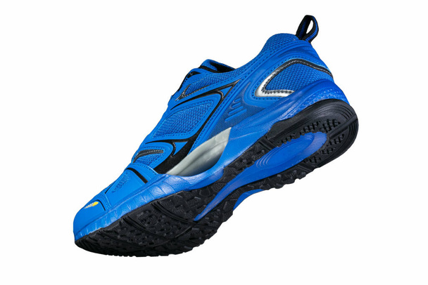 Blue sneaker with black accents on a black sole. insulated. Sport shoes. - Photo, Image