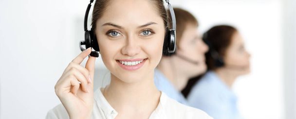 Call center. Diverse customer service operators in headsets at work in office. Business concept - Foto, Imagem