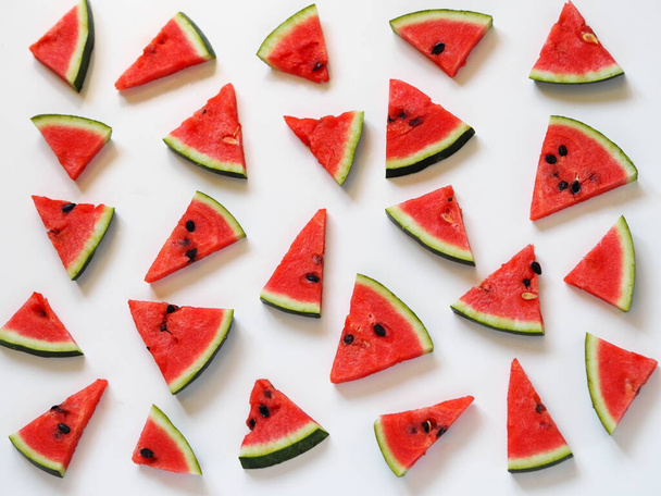 Watermelon slices in the background. Healthy natural food rich in vitamins Watermelon is a popular organic food product. - Photo, Image
