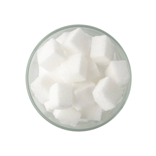 White sugar cubes in glass bowl isolated. Refined white sugar cube top view - Fotó, kép