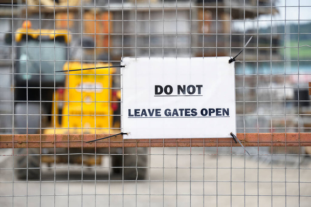 Do not leave gates open sign at construction site - Photo, Image