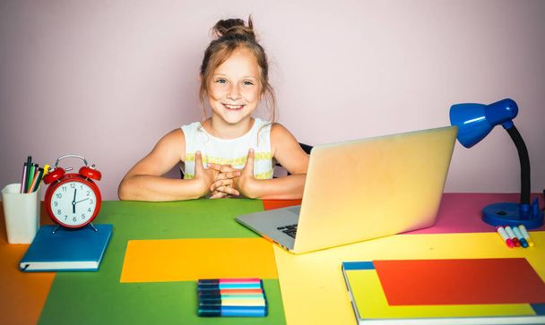 Cute little girl studying. Online home school lessons. - Valokuva, kuva