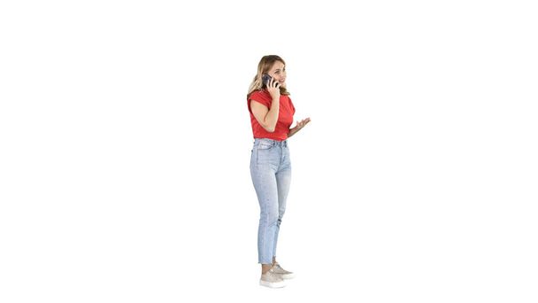 Young woman talking on mobile phone on white background. - Fotó, kép