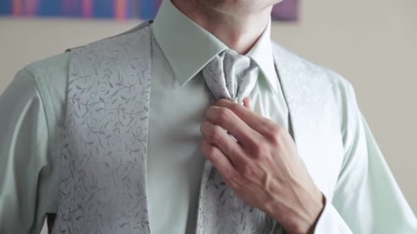 Handsome businessman man straightens his tie. - Footage, Video