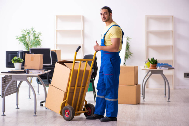 Young male contractor in moving concept - Photo, image