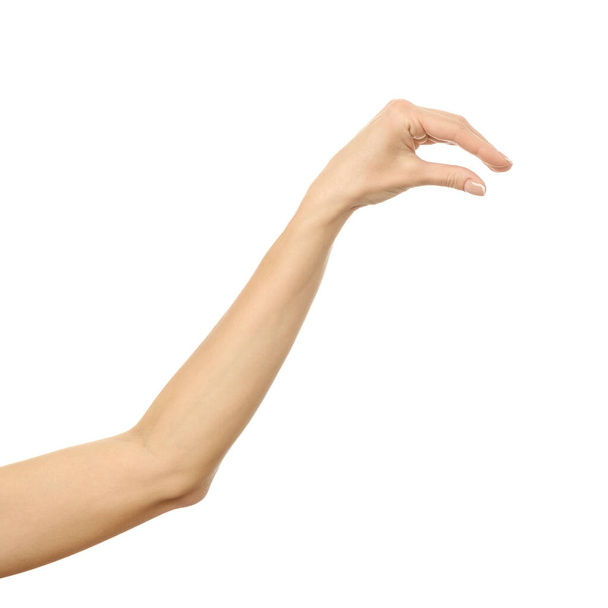 Hand picking, holding, grabbing or reaching. Woman hand gesturing isolated on white - Φωτογραφία, εικόνα
