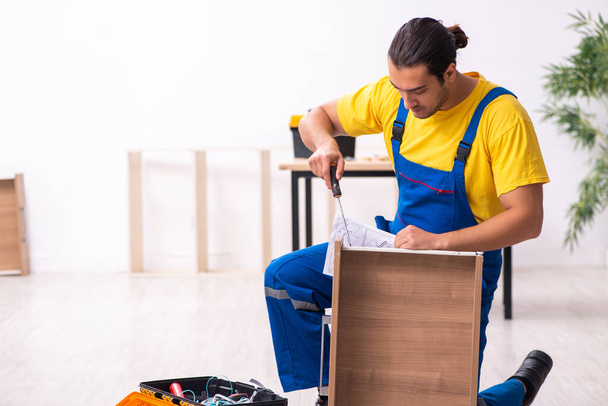Young male carpenter working indoors - Фото, зображення