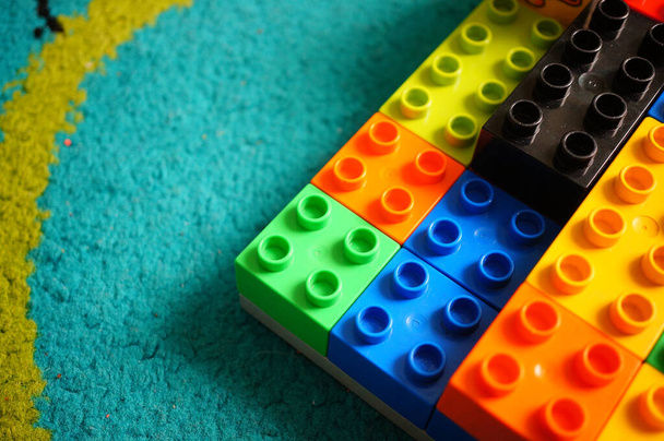 POZNAN, POLAND - Sep 02, 2020: Colorful plastic Lego Duplo blocks laying on a floor - Фото, изображение