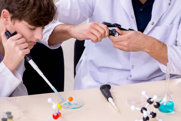 Young father and son chemists in the lab - Photo, Image