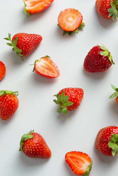 Close up of ripe strawberry on white table - Fotó, kép