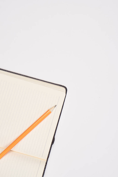 Notepad with pen stationery accessories beige background - Zdjęcie, obraz