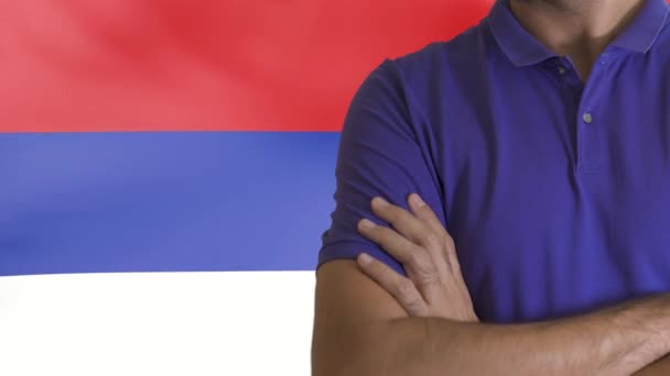 Torso of a man Young man with arms crossed against the Russian Federation national flag - Footage, Video