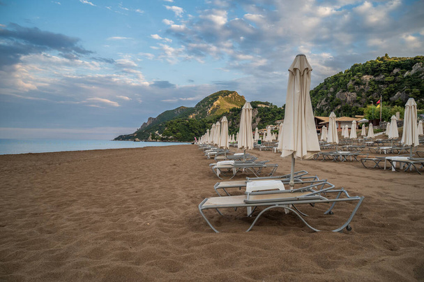 lounge chairs on the beach, Corfu, Greece - Photo, Image