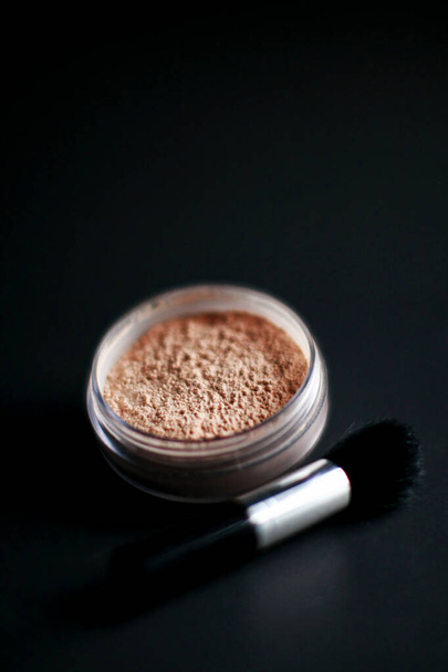 Cosmetic make-up on black background - Photo, Image
