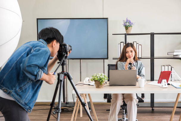 Behind the scene concept. Videographer test to record footage before streaming live online of beautiful attractive Asian woman blogger with studio lighting. broadcasting vlogger, internet influencer. - Photo, Image