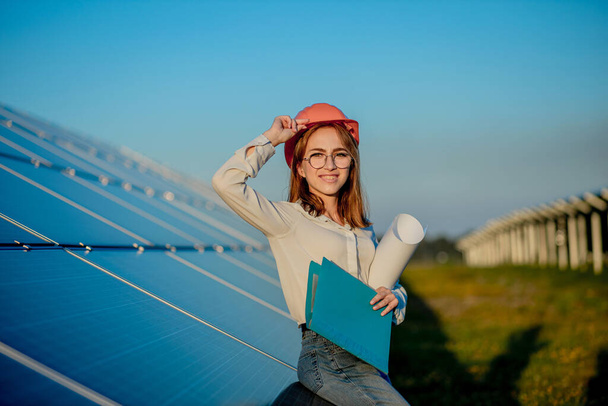 Businesswomen working on checking equipment at solar power plant with tablet checklist, woman working on outdoor at solar power plant. - Φωτογραφία, εικόνα