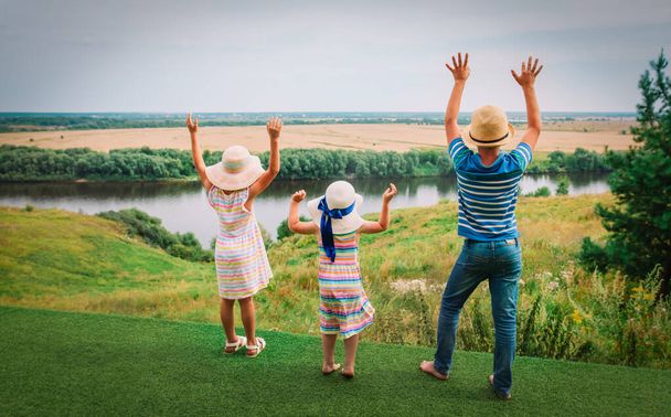 happy kids enjoy travel in nature, boy and girls hands up - Photo, Image