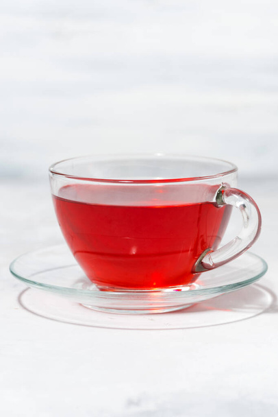 cup of fruit tea, vertical closeup - Foto, immagini