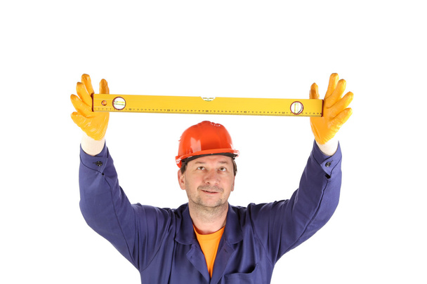 Worker in hardhat with measure ruler. - Foto, Bild