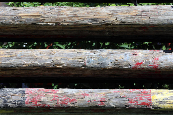 Photo of show jumping poles wooden barriers for jumping horses as a background - Photo, Image