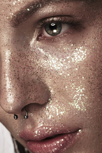 Portrait of beautiful woman with art glitter makeup on her face, - Фото, зображення