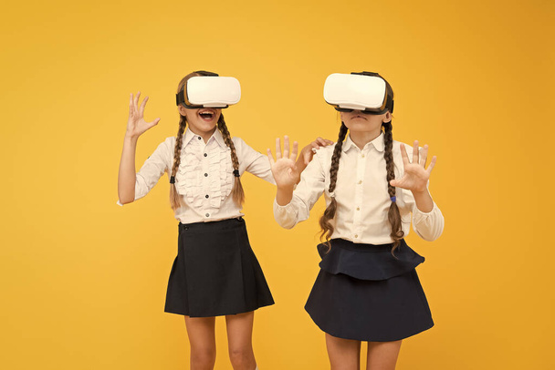 Another reality is here. future education. back to school. virtual reality. small girls in VR headset. Digital future innovation. children wear wireless VR glasses. Happy kids use modern technology - Fotoğraf, Görsel