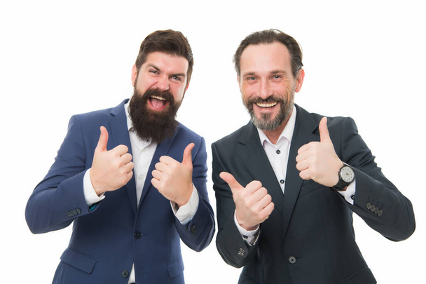 We offer only the best. Happy businessmen give thumbs up hands. Bearded men smile with thumbs up gesture. Gesturing thumbs up. Hand signs. Thumbs up approval - Photo, Image