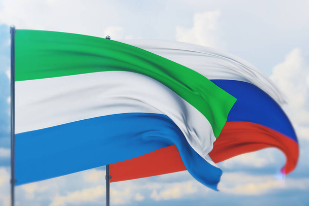 Zwaaiende Russische vlag en vlag van Sierra Leone. Close-upweergave, 3D-illustratie. - Foto, afbeelding