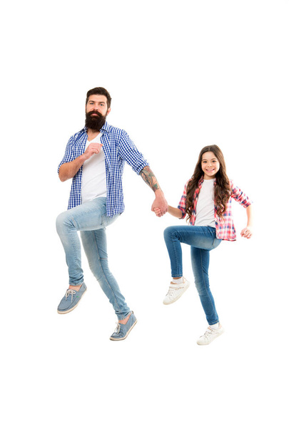 Love more worry less. Happy father and daughter walk holding hands. Bearded man and little child enjoy studio photo shoot. Family love. Love and trust. Do what you love - Photo, image