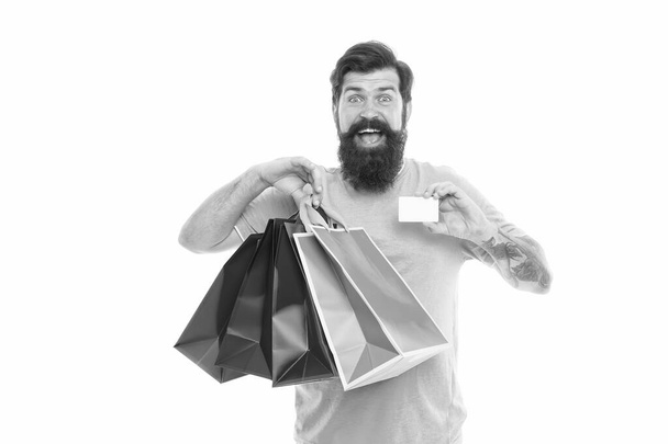 Happy man shopping. Payment method. Bank card. Black friday sale. Satisfied customer. Easier than ever. Contactless payment. Credit card. Bearded man with bags and discount card. Purchase concept - Фото, зображення