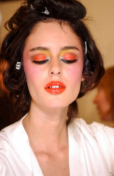 PARIS FRANCE - OCTOBER 12, 2003 Model Nicole Trufio getting ready backstage for runway fashion show of Valentino Ready-To-Wear collection during Paris Spring Summer 2004 fashion week. Paris, - 写真・画像