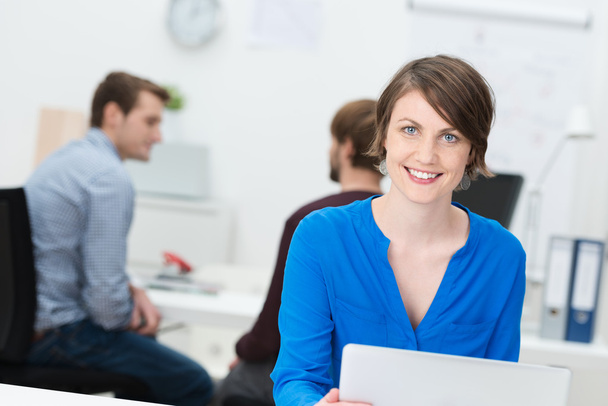 Smiling attractive businesswoman in the office - Photo, Image