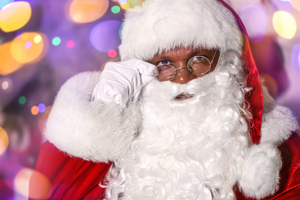African-American Santa Claus against blurred lights - Photo, Image