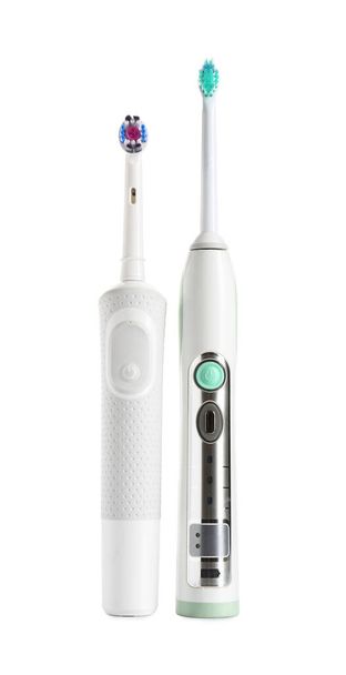 Escovas de dentes elétricos no fundo branco - Foto, Imagem